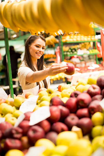 istock Young woman on the market 615996880