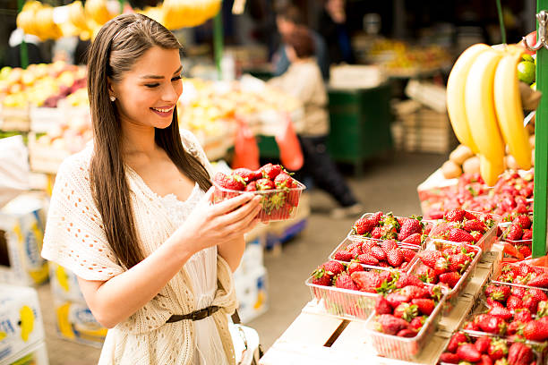 istock Young woman on market 615996924