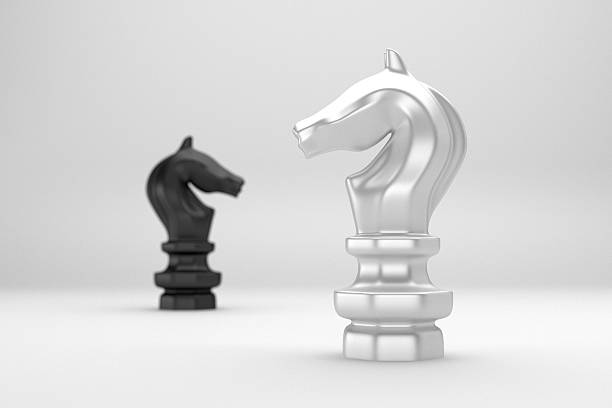 istock Knight chess confront black and white on white background 616001600