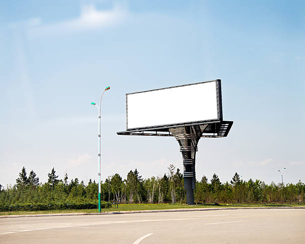 istock Blank advertising board on street 616003308