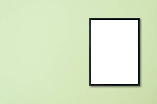 istock Mock up blank frame hanging on wall in room 616004360