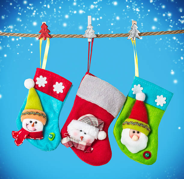 istock Christmas socks hanging on the background  a blue 616005848