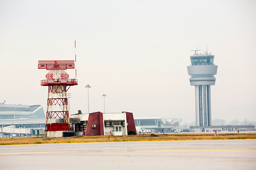 Airport control tower (right) and radar communication tower (left) at Sofia's airport.