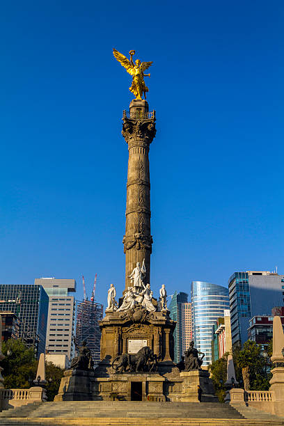 Mexico City, Mexico - February, 7, 2014:  The Angel of Independence monument on the Paseo de la Reforma in Mexico City, the monument representing Mexico’s indolence is placed on the boulevard that is equivalent to Mexico’s Wall Street.