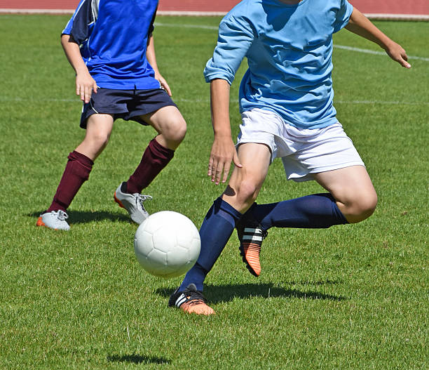 istock Kids are playing soccer 616008264