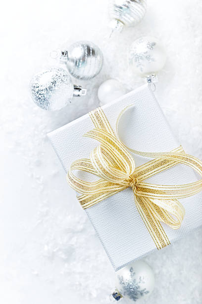 istock White Christmas Gift with gold ribbon 616009178