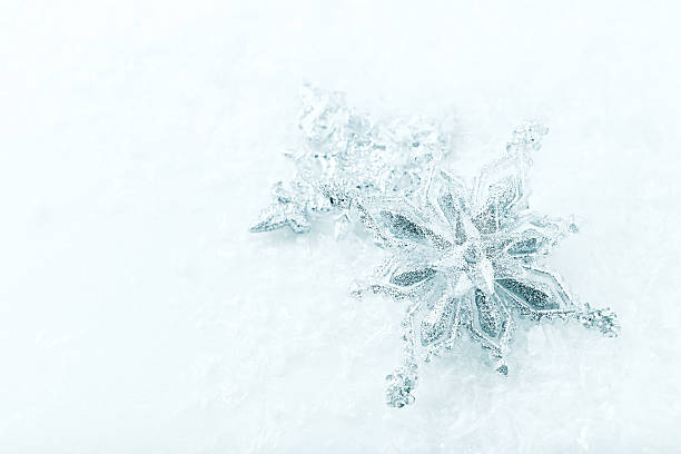 istock Silver Christmas Stars on a white background with snow 616009468