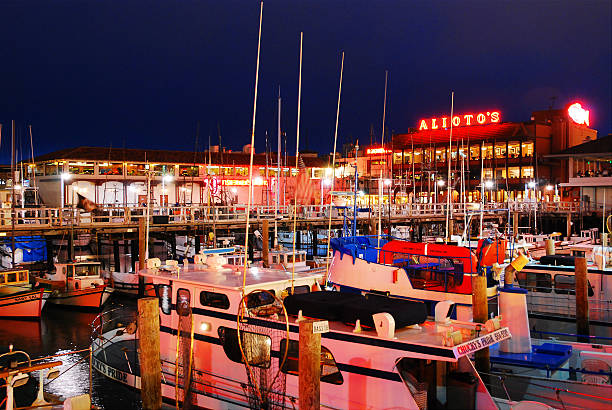 People visting Pier 39, a popular spot with restaurants and shopping, at Fishermans Wharf at afternoon in San Francisco