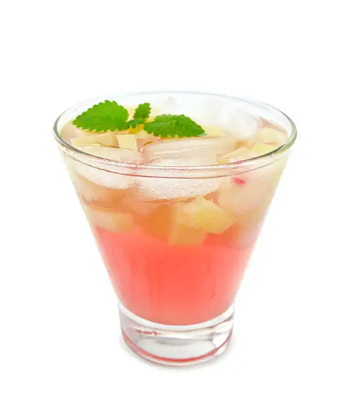 Lemonade with rhubarb and mint in a glass isolated on white background
