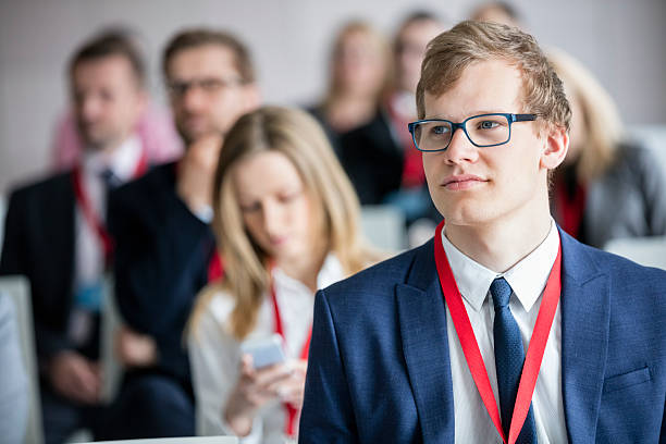 istock Businessman attending seminar in convention center 616010608