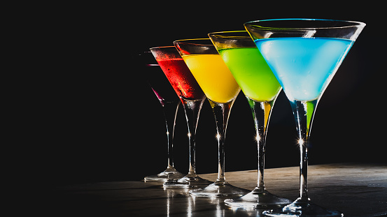 Multicolored cocktails at the bar.