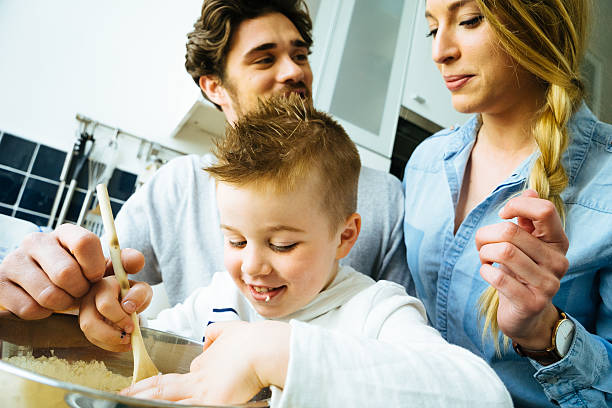 istock Happy Family Having Fun While Preparing Food Together 616012240