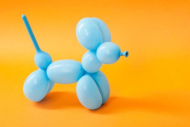 istock Blue balloon dog on orange 616015246