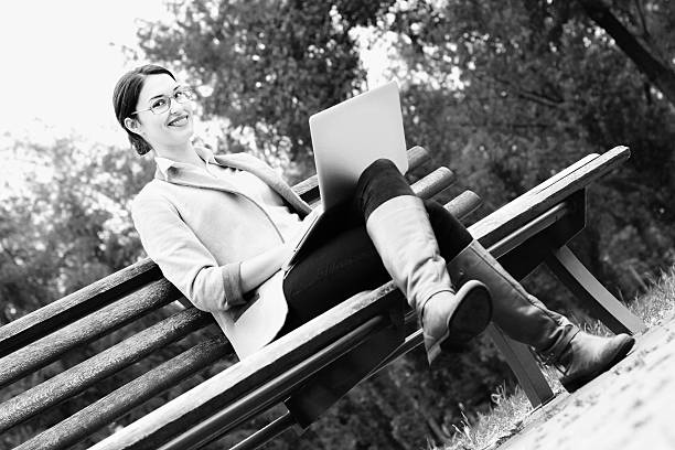 istock Woman in park with laptop BNW 616015626