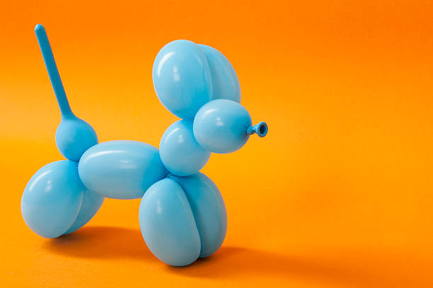 istock Blue balloon dog on orange 616016482