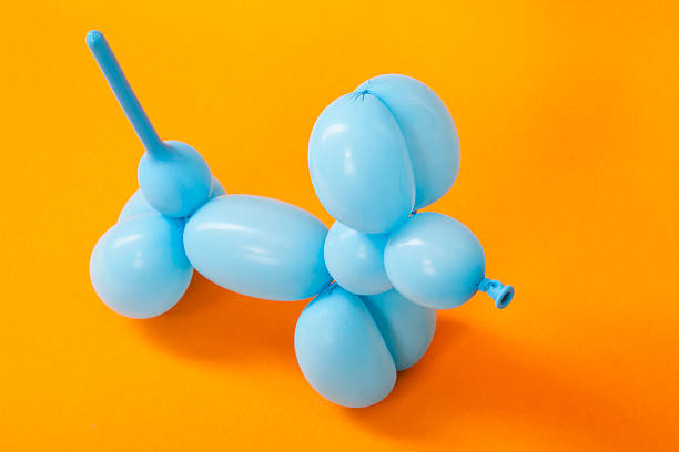 istock Blue balloon dog on orange 616016696