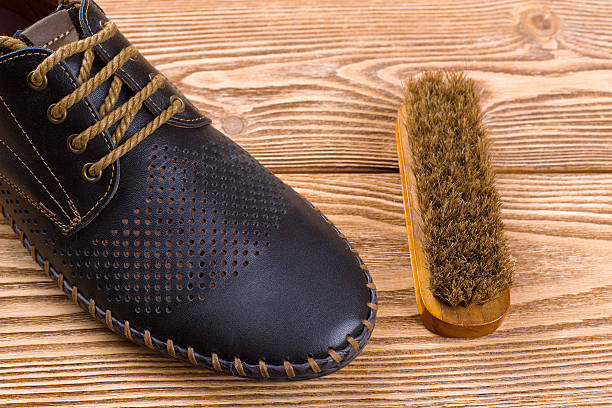 istock Men's leather shoes and shoe brush 616016698