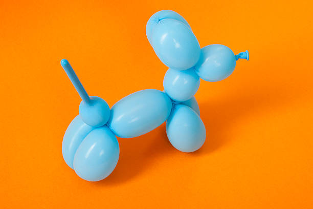 istock Blue balloon dog on orange 616016782