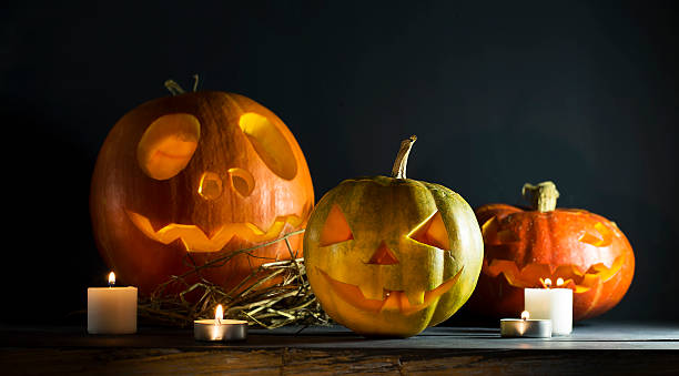istock Halloween pumpkin with candles 616020666