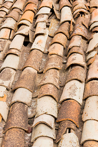 istock Close up view old, broken and ruined roof tiles 616089432