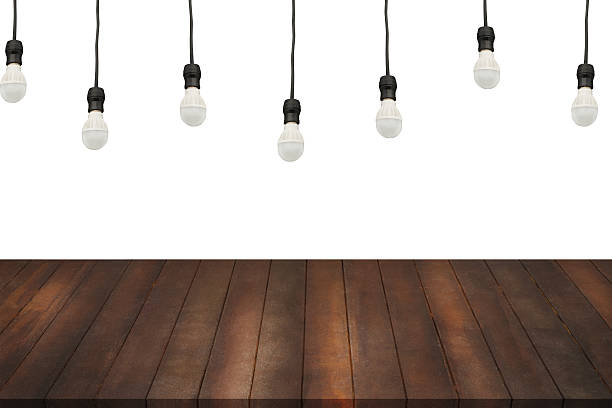 istock wood shelves and lamp light on isolated white background. 616090502