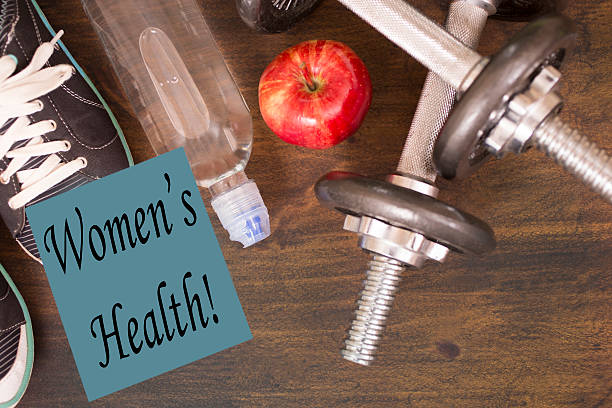 istock Fitness, exercise themed scene with Women's Health note. 616093286