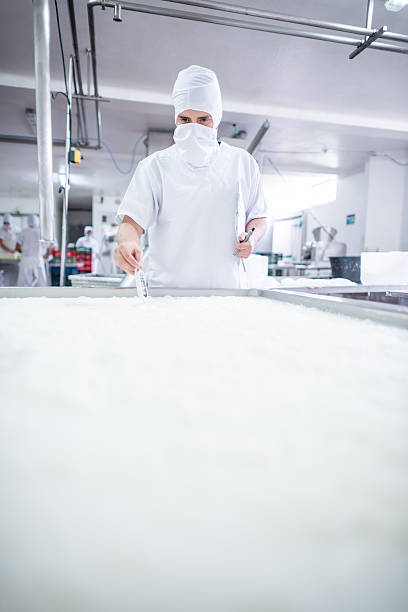 istock Man working at a dairy factory 616093378