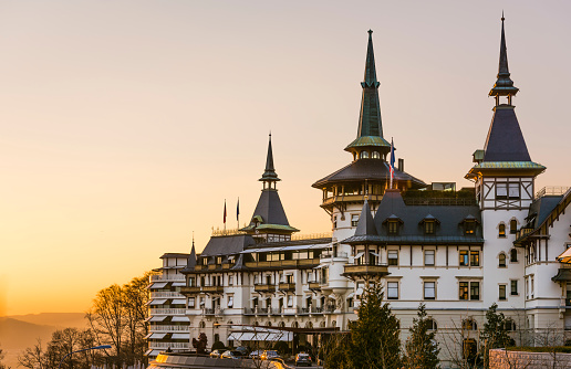 Zurich, Switzerland - March 18, 2016: Exterior view of The Dolder Grand (formerly known as Grand Hotel Dolder) luxury hotel in Zurich in the sunset. Built in 1899 and renovated 2004-2008 by Sir Norman Foster, the 5 star hotel offers 173 rooms and suites.