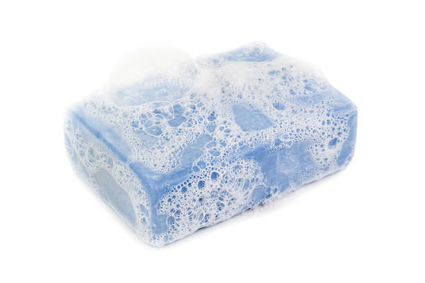 foam on blue soap foam on blue soap on white background bar of soap photos stock pictures, royalty-free photos & images