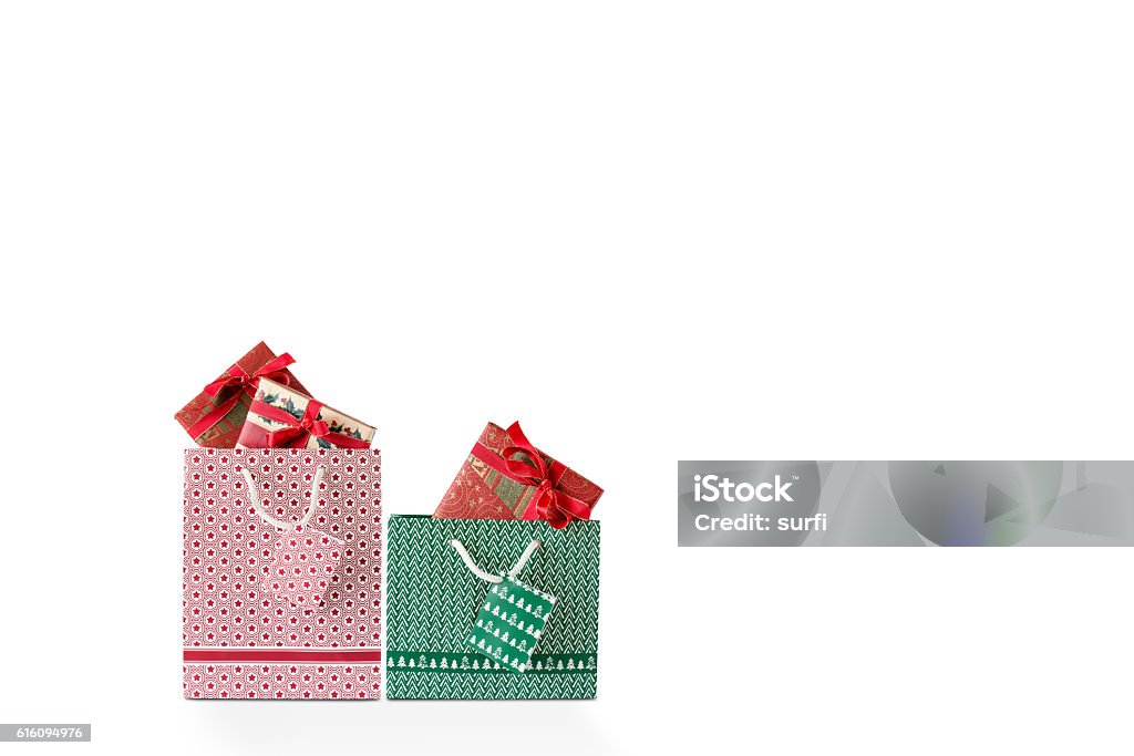 A Red and Green Shopping Bag A red and green shopping bag against a white background Gift Bag Stock Photo