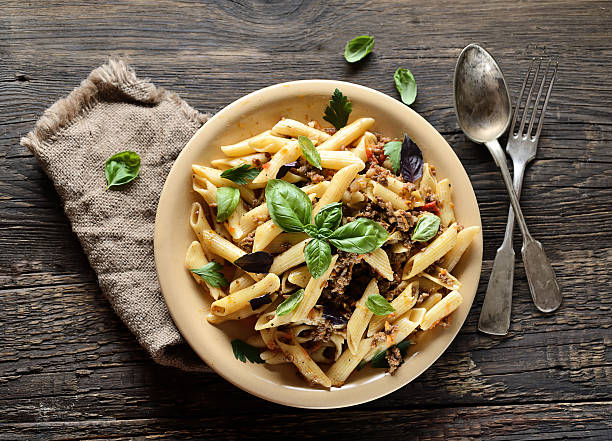 istock pasta with meat and basil on a plate 616095570