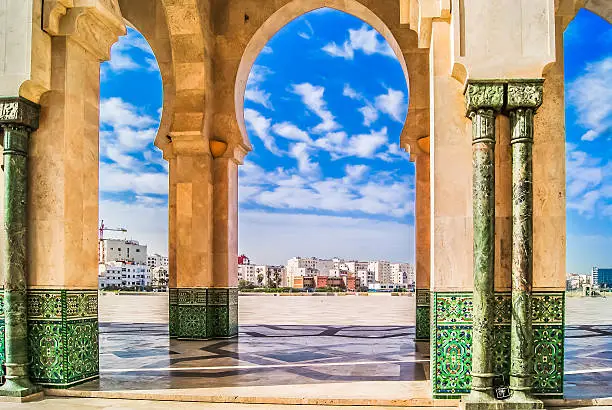 Architecture in Casablanca with town in background, Hassan II mosque decoration.