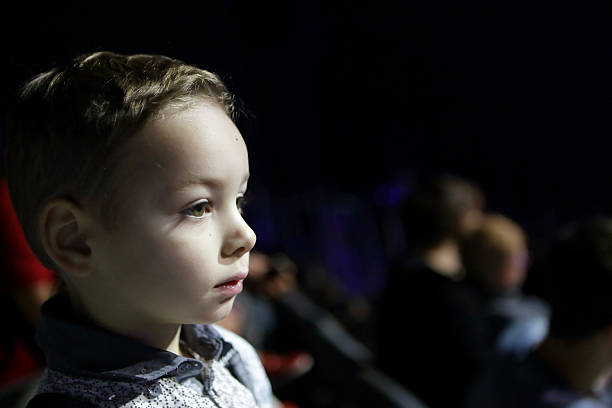 istock Boy at a theatre 616098684