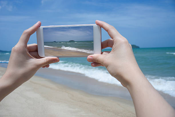 istock woman's hand holding smart phone,take photo 616098854
