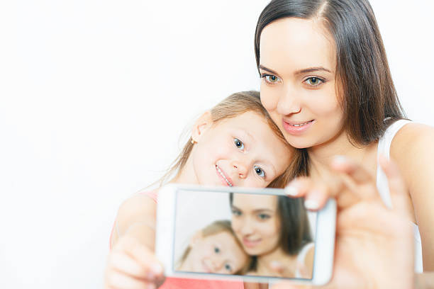 child and mother make selfie on mobile phone, good camera - mega pixels imagens e fotografias de stock