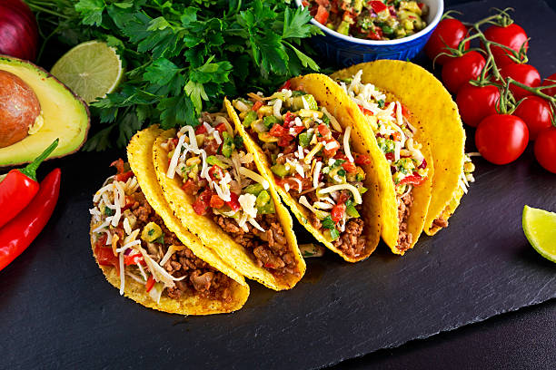 istock Mexican food - delicious taco shells with ground beef and 616102708