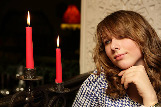 istock Girl with candles 616103212