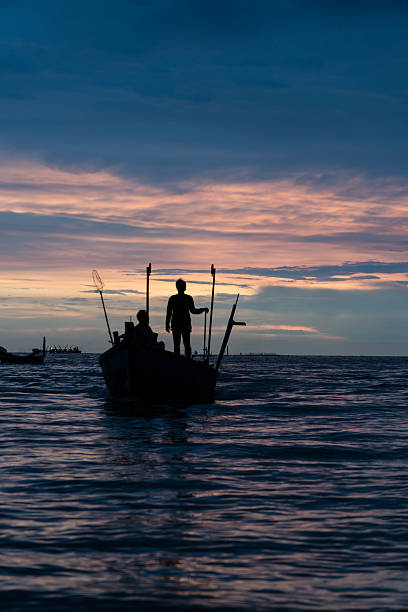 istock silhouette of fisherman 616104716