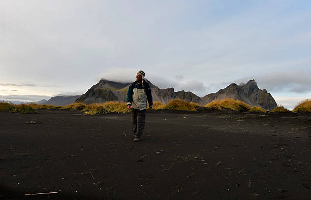 istock Mountains and volcanic lava sand dunes 616106128