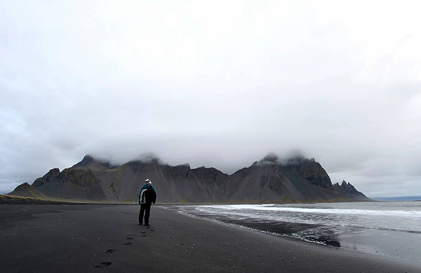 istock Mountains and volcanic lava sand dunes 616106296