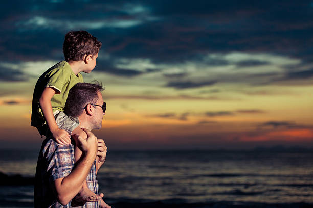 istock Father and son  playing  on the beach. 616106398
