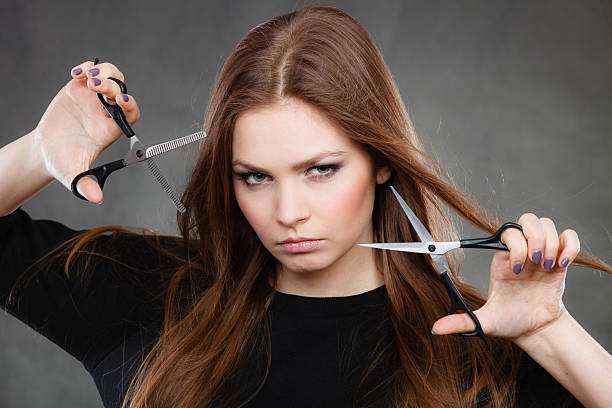 istock Female hairstylist barber with scissors. 616106968