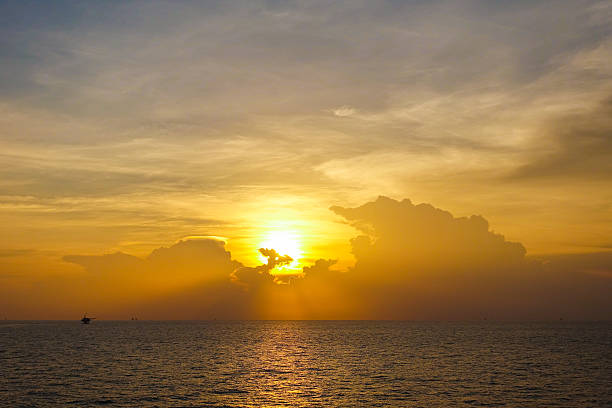 istock Sunset over the sea with beautiful clouds sky 616107740