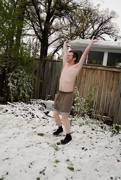 istock Man wears shorts in show backyard 616110300