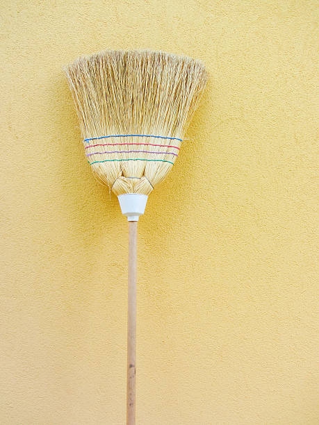istock isolated country broom on yellow background 616111240