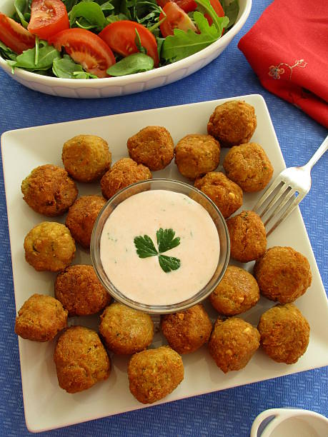 istock Falafel with yogurt sauce on square plate 616113306