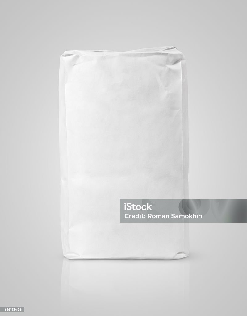 White blank paper bag package of flour on gray Blank white paper bag package of flour on gray background with clipping path Flour Stock Photo