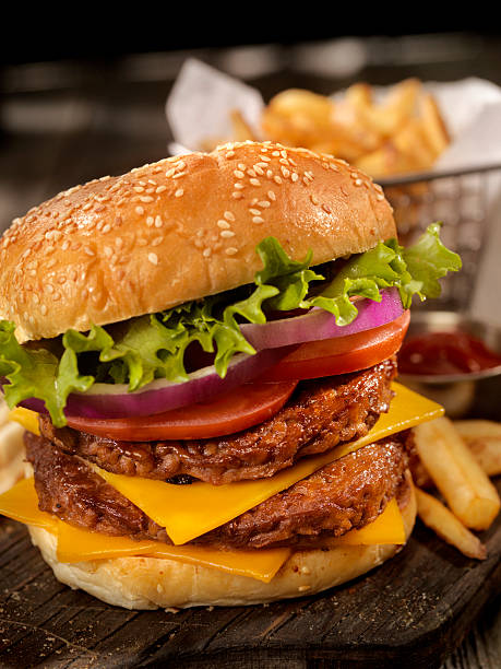 istock Double Cheeseburger with a Basket of Fries 616114170