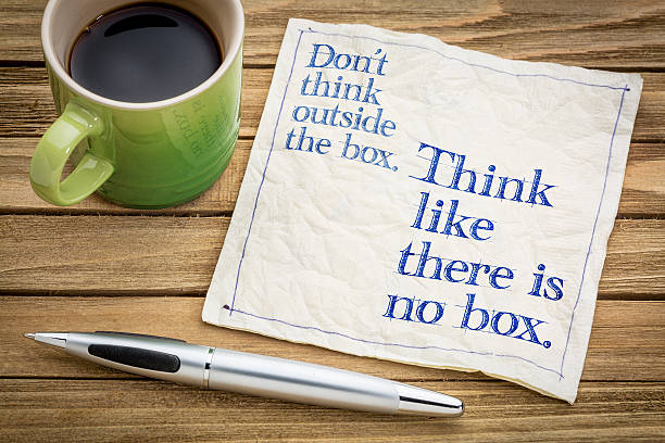 Think like there is no box. Don't think outside the box. Think like there is no box.- handwriting on a napkin with a cup of espresso coffee rebellion photos stock pictures, royalty-free photos & images