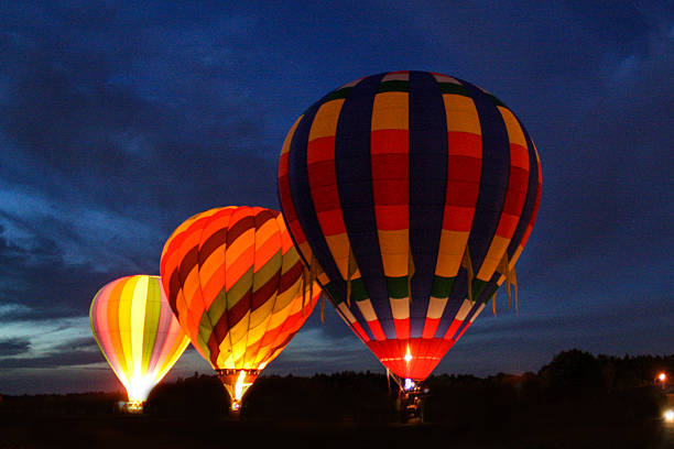 istock Hot Air Balloons at Night 616117718